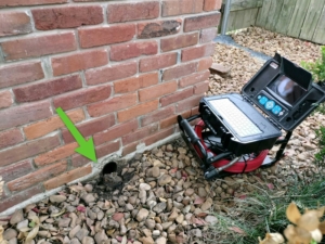 Sewer scope performing an inspection on cast iron pipes.