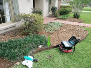 Sewer scope performing a video pipe inspection on front yard clean-out. 